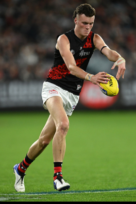 Nikolas Cox spent much of the first part of his career running off a wing, not a standard pathwayfor a kid standing 200cm tall and weighing close to 95kg. Cox has obvious aerobic advantages over most players with that body shape, however, and it is clear that Essendon wants him to use that pace and endurance on the outside. However, the club has often started him in a more traditional key defender role in the second half of the season. Can he find a wing spot in the Dons' best 22 to push Sam Durham or Nic Martin to a half forward flank? He's a prototype... but of what?